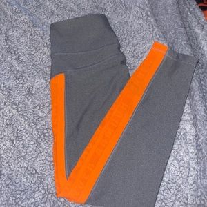 Gray and orange under armor leggings
